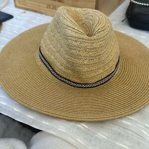 Woman’s tan wide brimmed hat